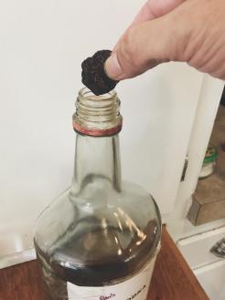 fig vodka fig piece over bottle